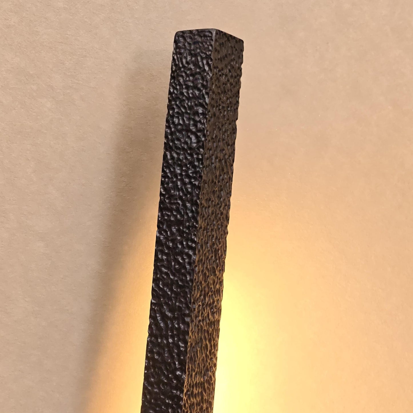 Dark textured rectangular block on a gradient background