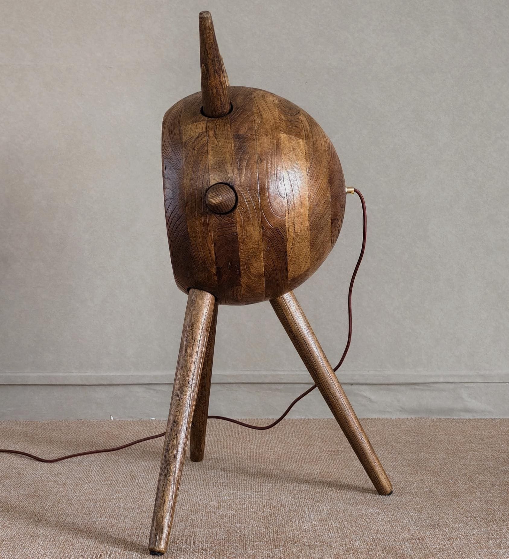 Wooden lamp with a unique design on a neutral background