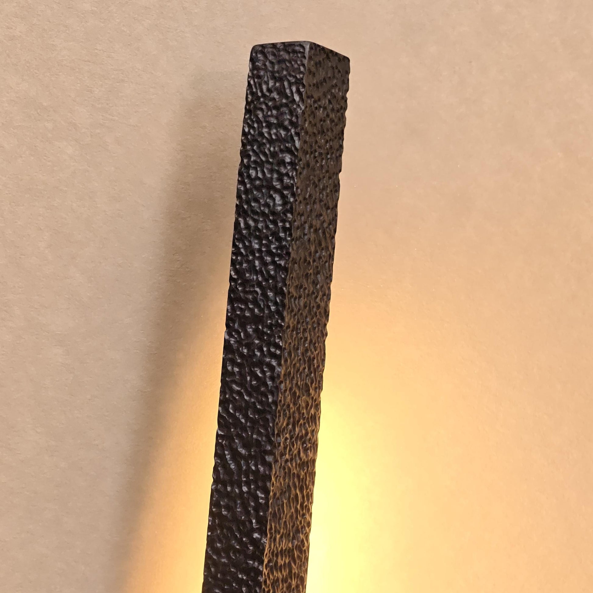 Dark textured rectangular block on a gradient background